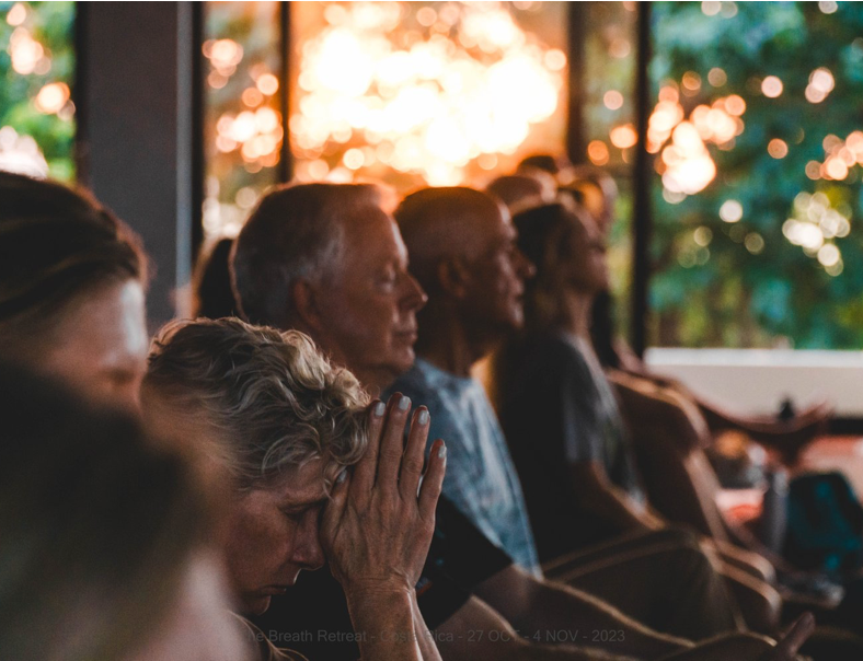 Evening breathwork session with participants in peaceful meditation